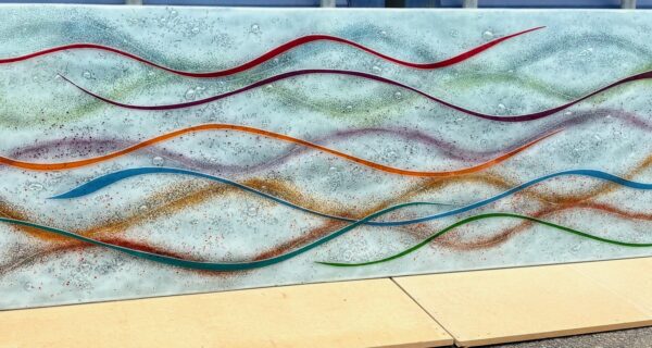 Semi-transparent white glass panel with a multicoloured flowing design, measuring 172.7 x 60 cm